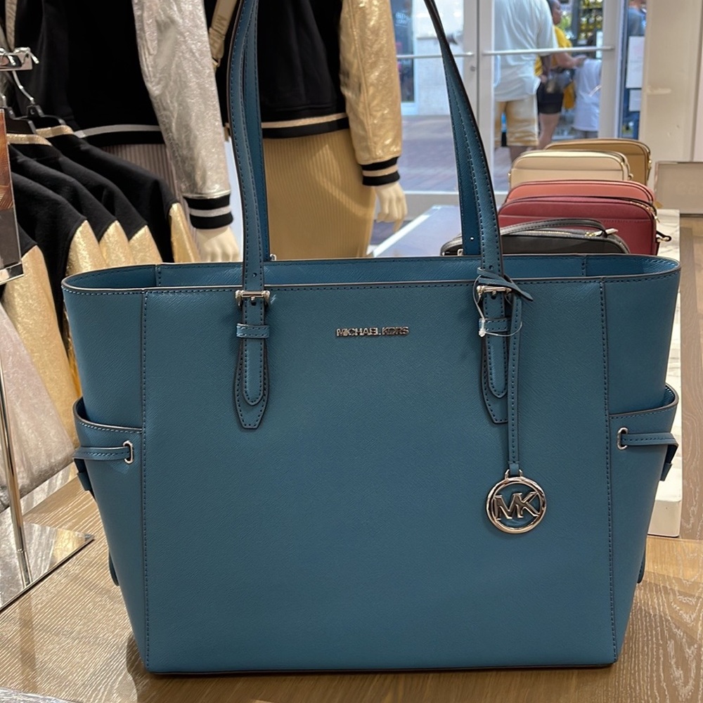 Michael Kors Gilly Large Drawstring Travel Leather Top Zip Tote
 Color: TEAL
NWT - Picture 2 of 16